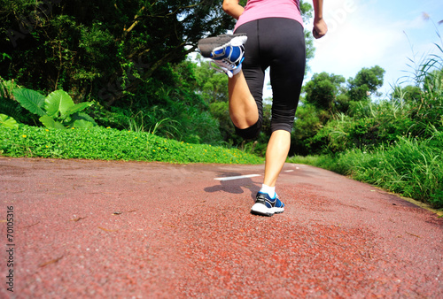 fitness woman runner running on trail © lzf