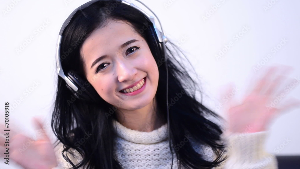 Asian woman teenager listing for relaxation with Headphone Asian woman teenager listing for relaxation with Headphone
