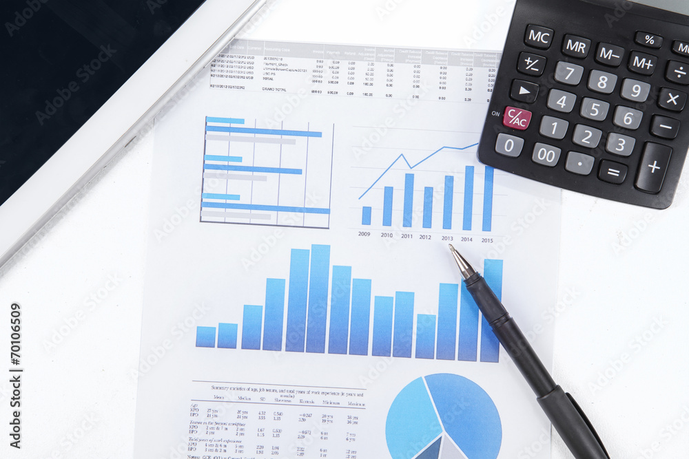 Business chart, calculator, and digital tablet Business chart, calculator, and digital tablet