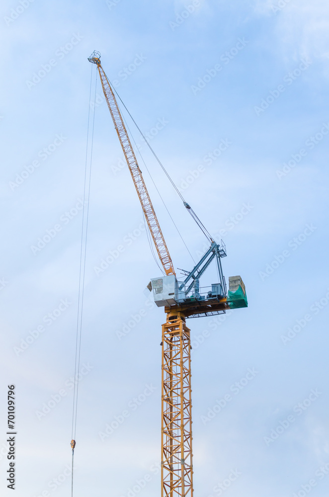 Yellow crane in a construction site