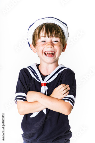 Cute little boy dressed in sailor suit photo