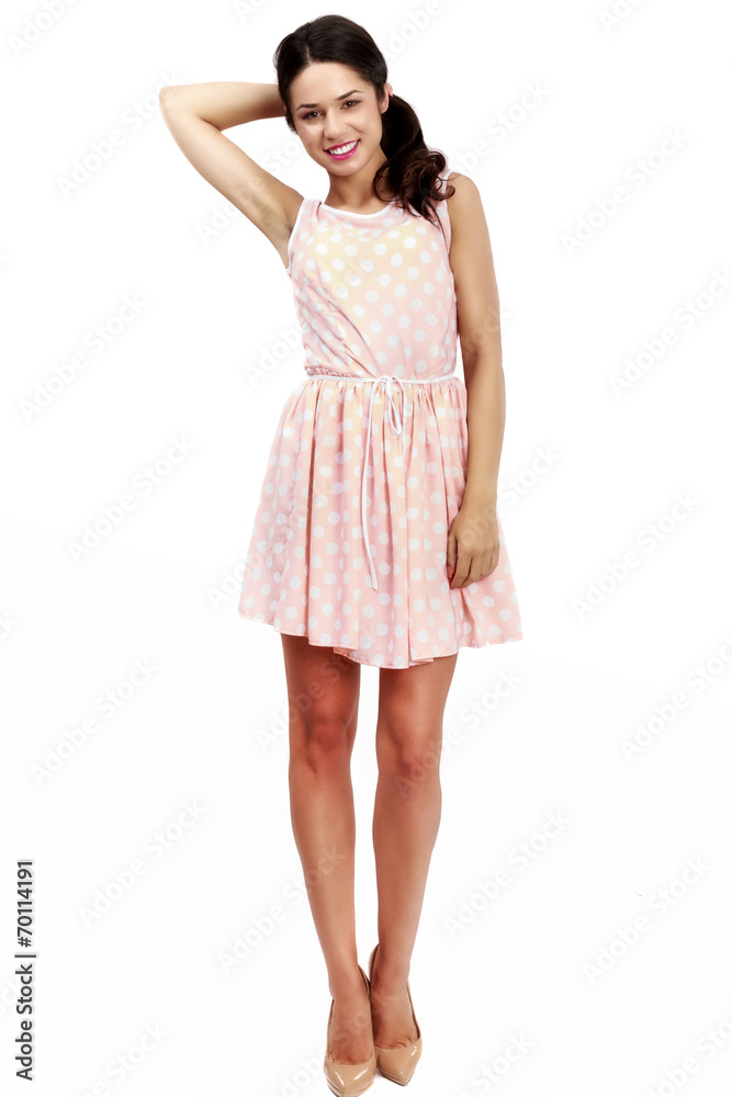 Beautiful woman in pink dress on white background