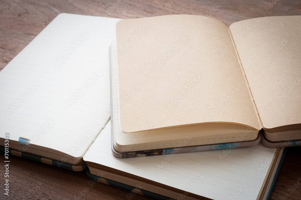 Fototapeta premium open old book on wooden background