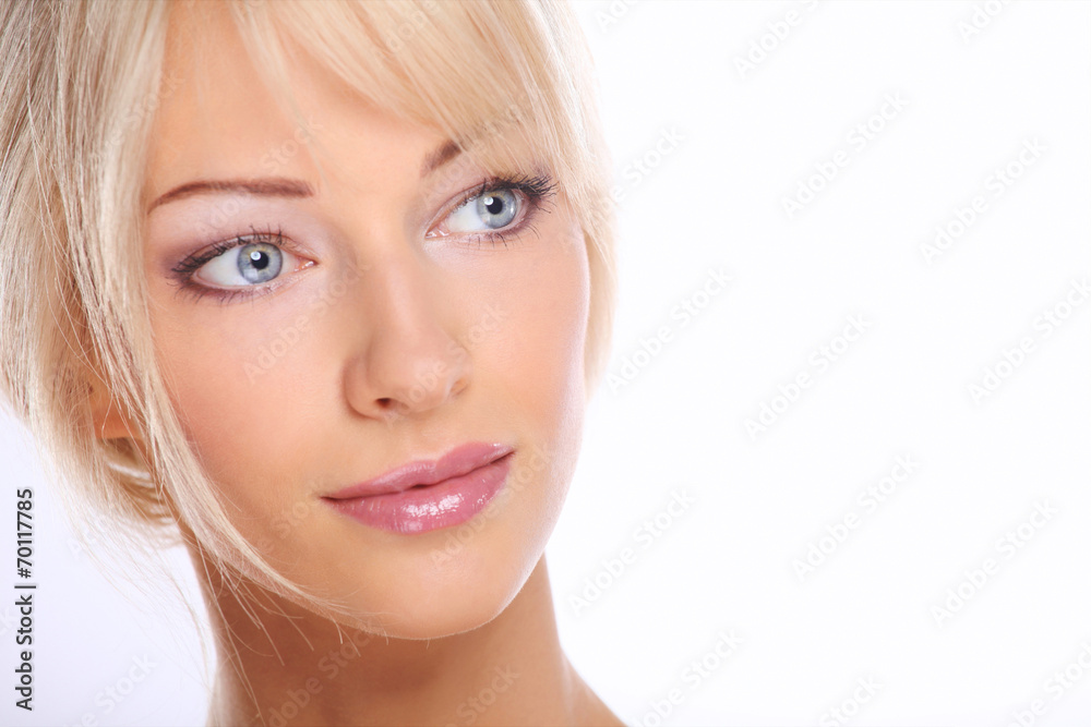 Close up portrait of beautiful young woman face. Isolated on wh