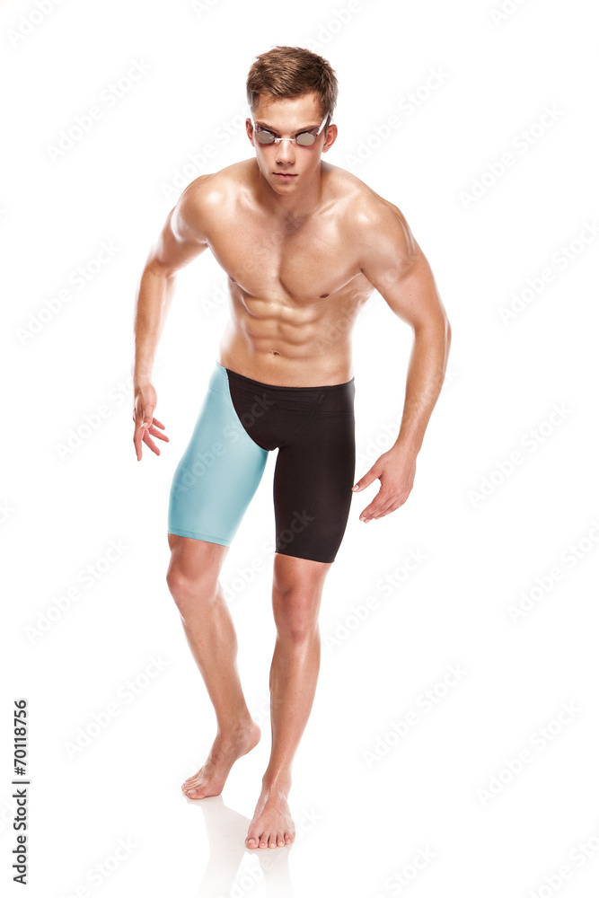 Young attractive caucasian man swimmer with goggles and towel
