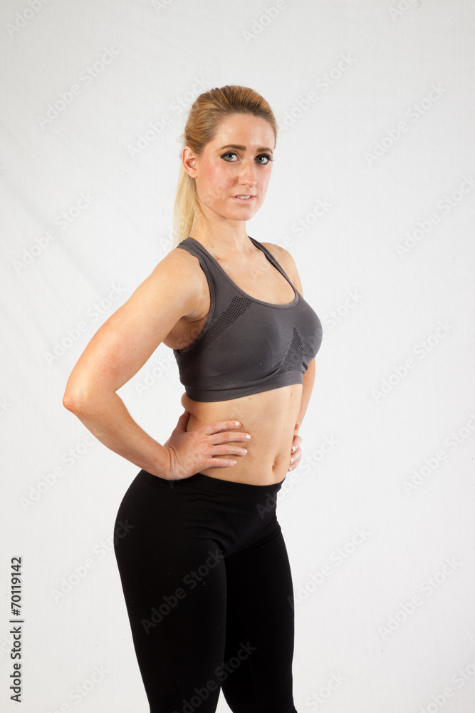 Blond woman in exercise outfit, looking at the camera Blond woman in exercise outfit, looking at the camera