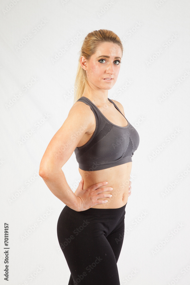 Blond woman in exercise outfit, looking at the camera Blond woman in exercise outfit, looking at the camera