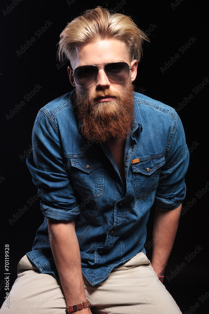 Fototapeta premium Cool man sitting and looking at the camera.