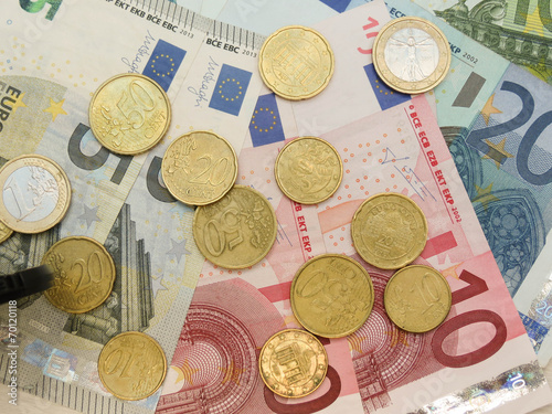 Euro banknotes and coins photo