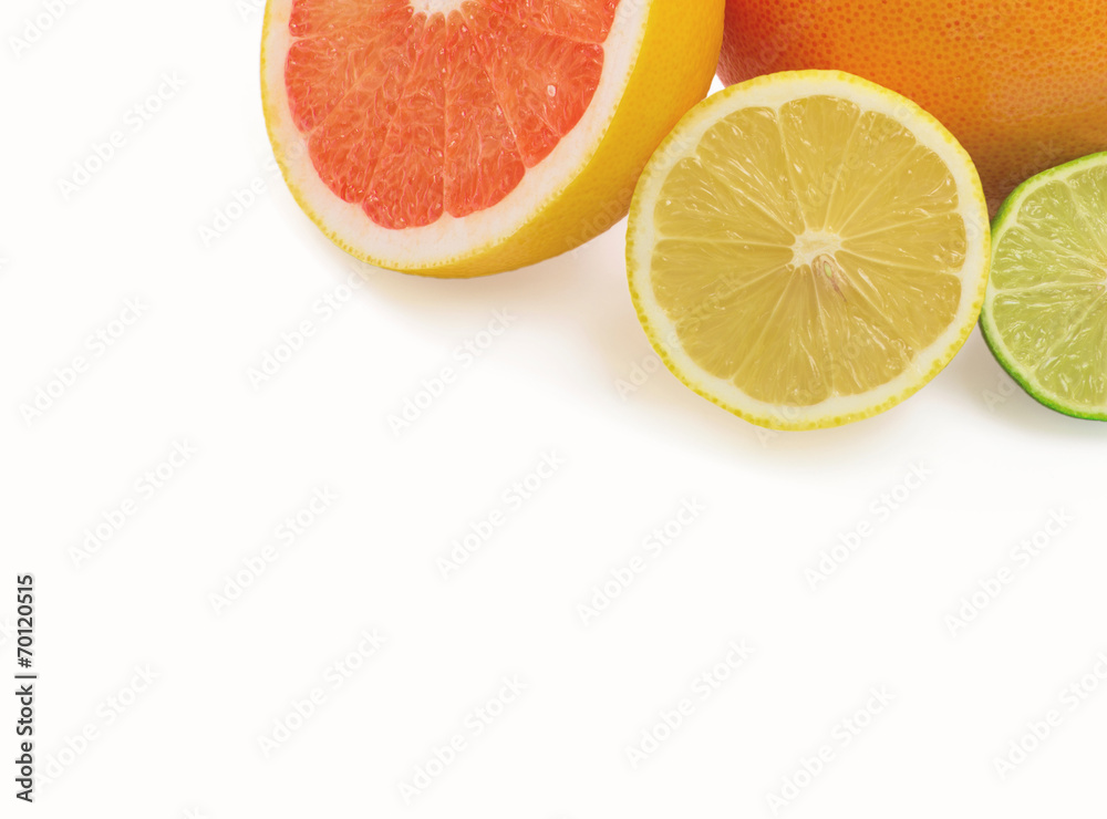 Image of a fresh whole lime, lemon and orange isolated on white