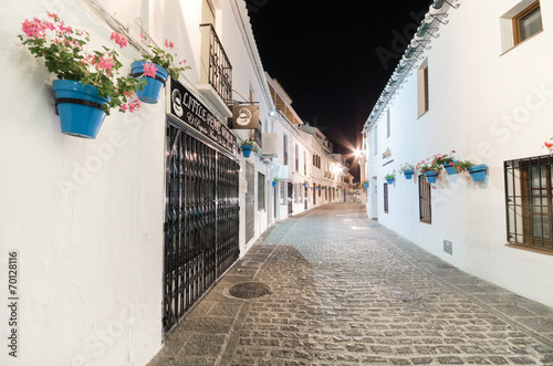 Narrow alley in Mijas village at night, Malaga, Spain.