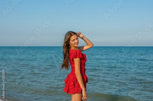 Young happiness woman on the sea