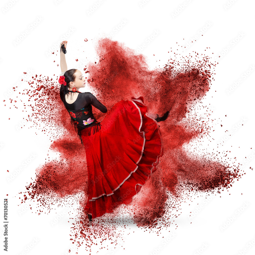 Fototapeta premium young woman dancing flamenco against explosion