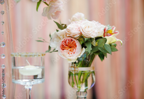 Flowers bouquet and candle as decoration