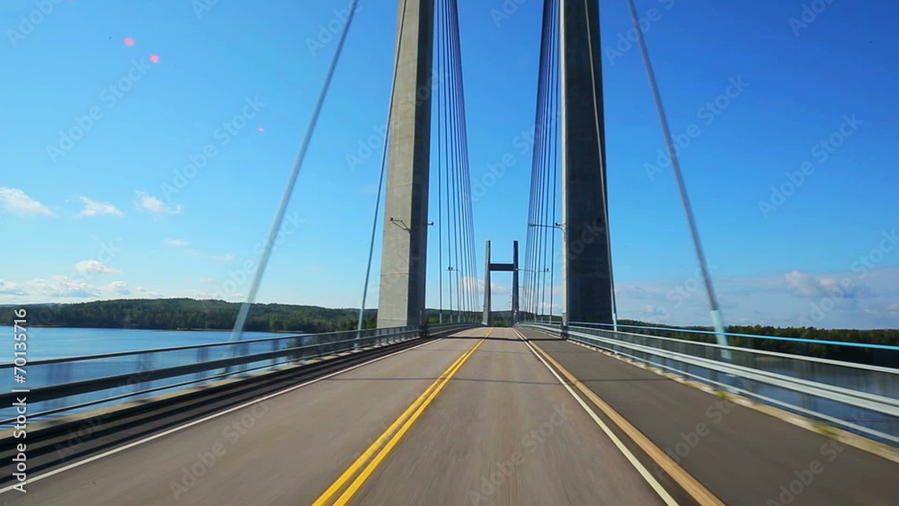 Road travel on bridge in Finland.
