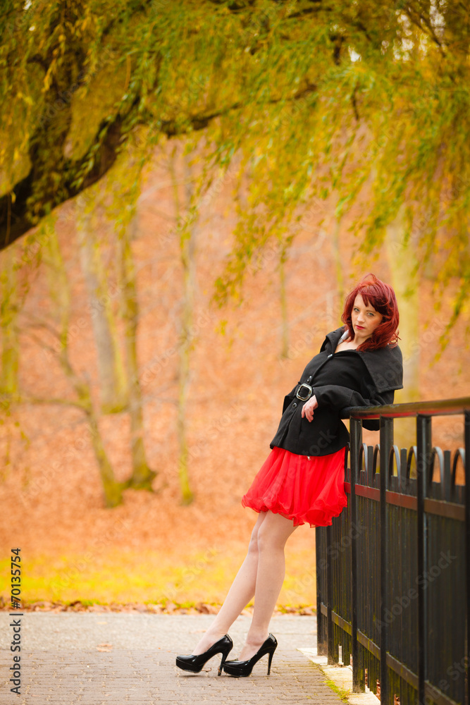 Fashion woman relaxing walking in autumn park Fashion woman relaxing walking in autumn park