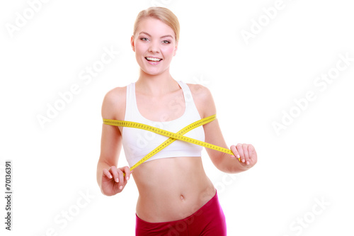 Fitness woman fit girl with measure tape measuring her bust © Voyagerix
