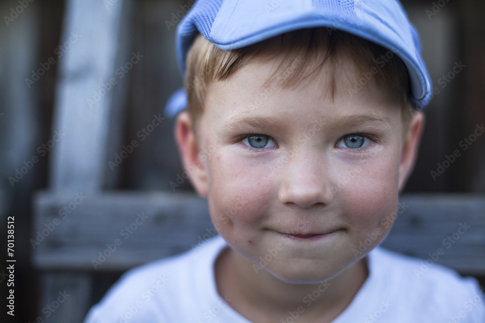 Close-up portrait of a funny little boy, outdoors. Close-up portrait of a funny little boy, outdoors.