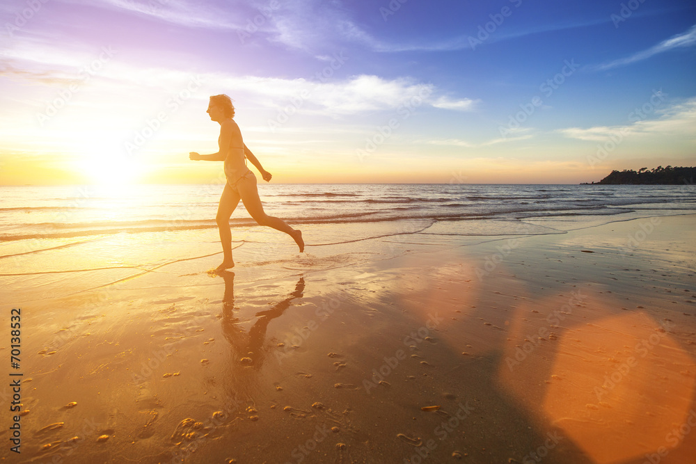 Silhouette of a girl running on ocean beach. Silhouette of a girl running on ocean beach.