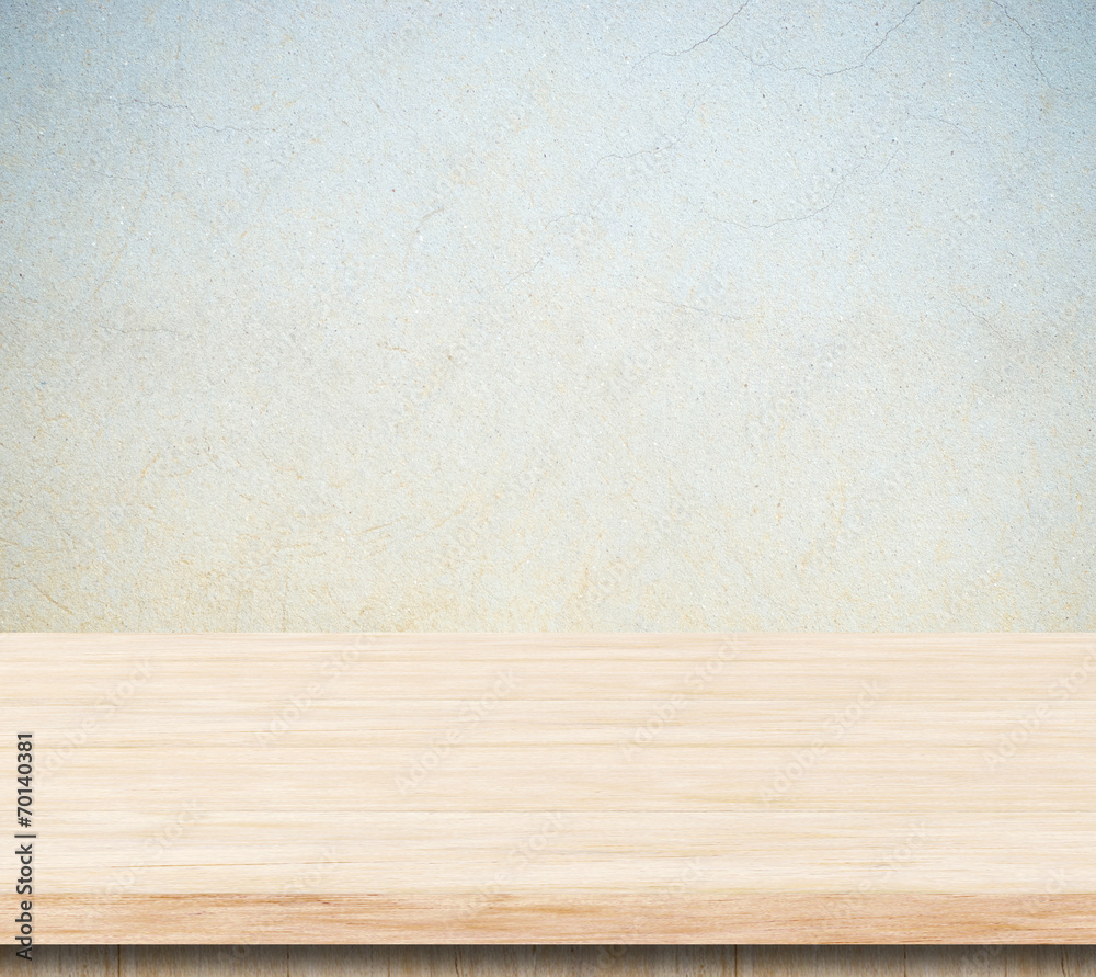 Empty wooden table over cement wall. Empty wooden table over cement wall.