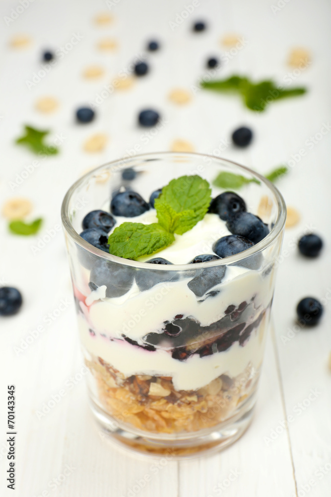 Natural yogurt with fresh berries on wooden table Natural yogurt with fresh berries on wooden table