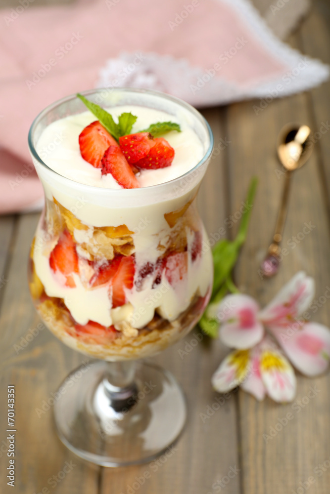 Natural yogurt with fresh berries on wooden table Natural yogurt with fresh berries on wooden table