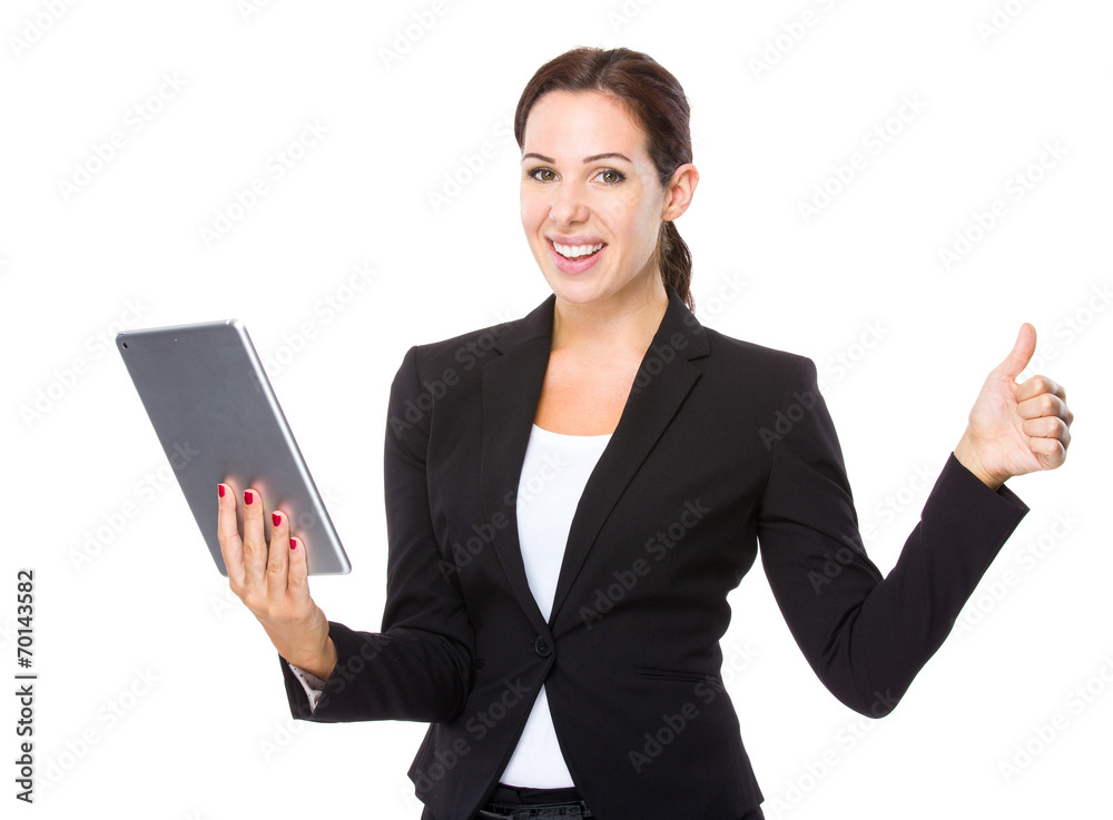 Businesswoman with tablet and thumb up