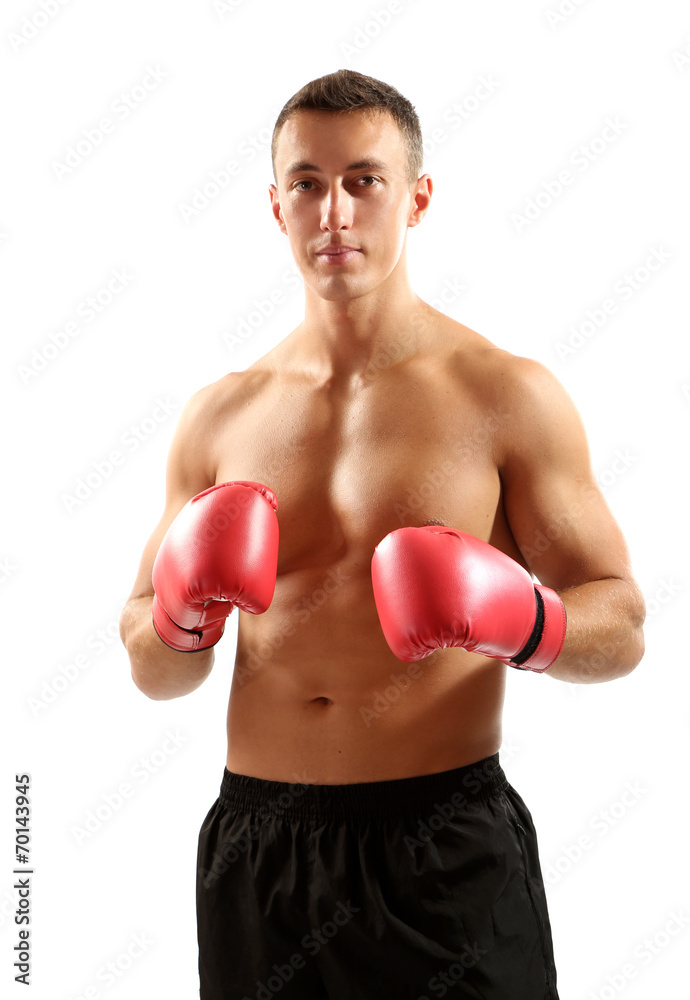 Handsome young muscular sportsman with boxing gloves isolated