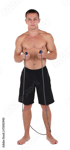 Handsome young sportsman holding rope isolated on white