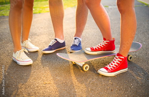 Young peoples legs with skateboard