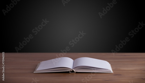 Open book on wooden deck