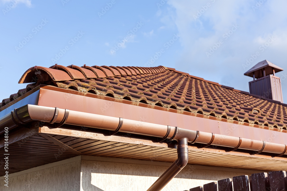Red tiled roof with gutter and chimney - obrazy, fototapety, plakaty 