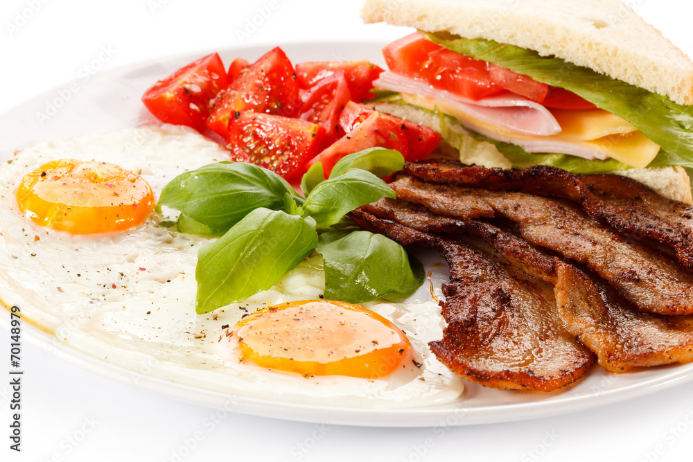 Breakfast - toast, egg, bacon and vegetables Breakfast - toast, egg, bacon and vegetables