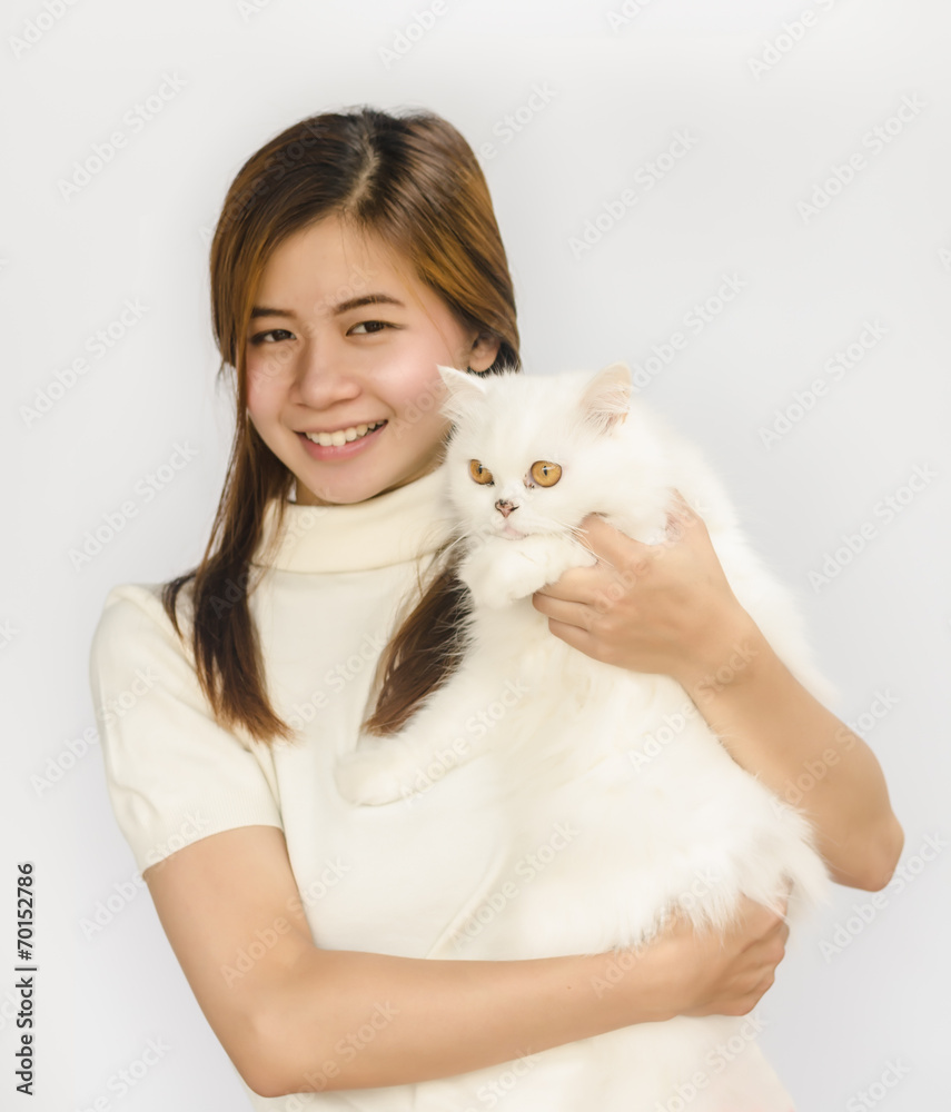 Asian teen and a  white cat
