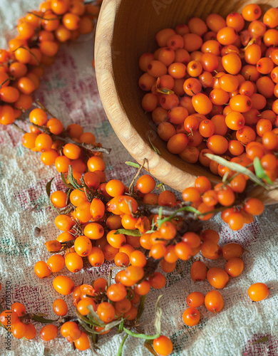 Fresh sea buckthorn on linen fabric