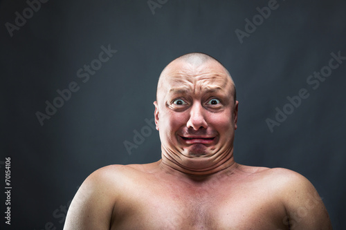 Portrait of bald scared man