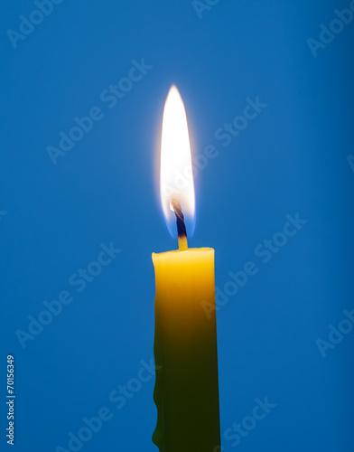 yellow Candle on blue background