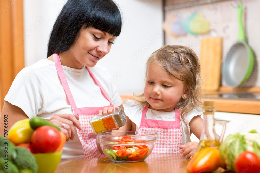 mom and kid girl preparing healthy food mom and kid girl preparing healthy food