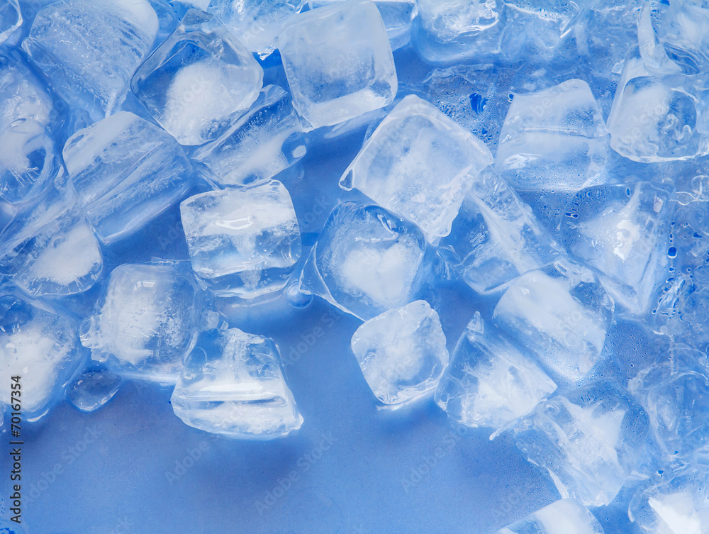 Ice cube on plastic blue tray Ice cube on plastic blue tray