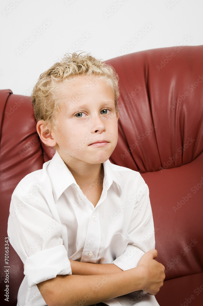 Fototapeta premium young blond boy on sofa