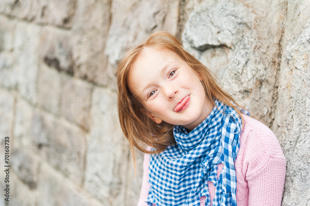 Outdoor portrait of adorable little girl