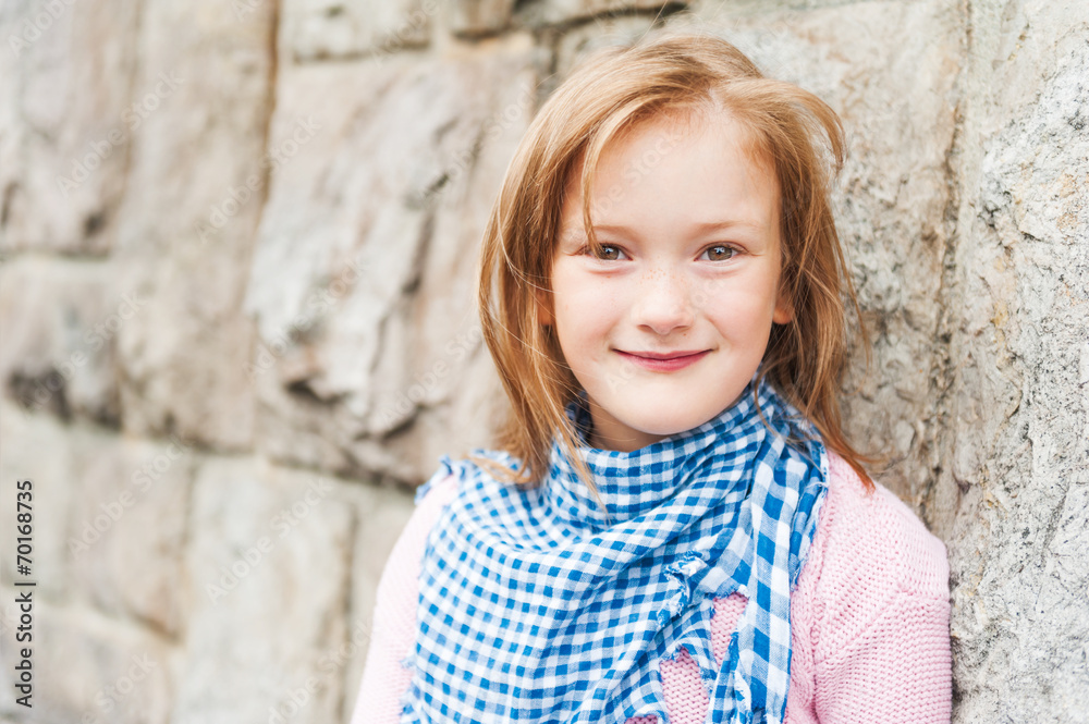 Outdoor portrait of adorable little girl