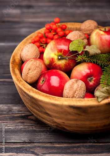 Red apples in wooden bowl.