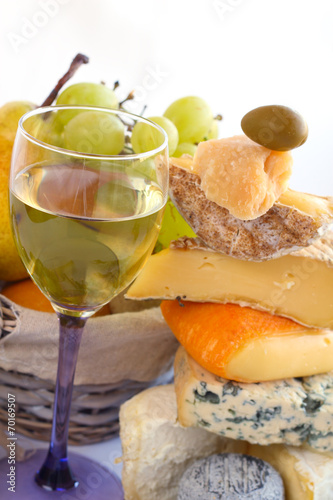 Cheese, wine and fruits photo