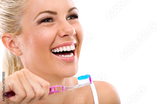 young woman holding a tooth-brush