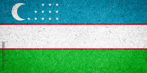 Uzbekistan flag on paper background