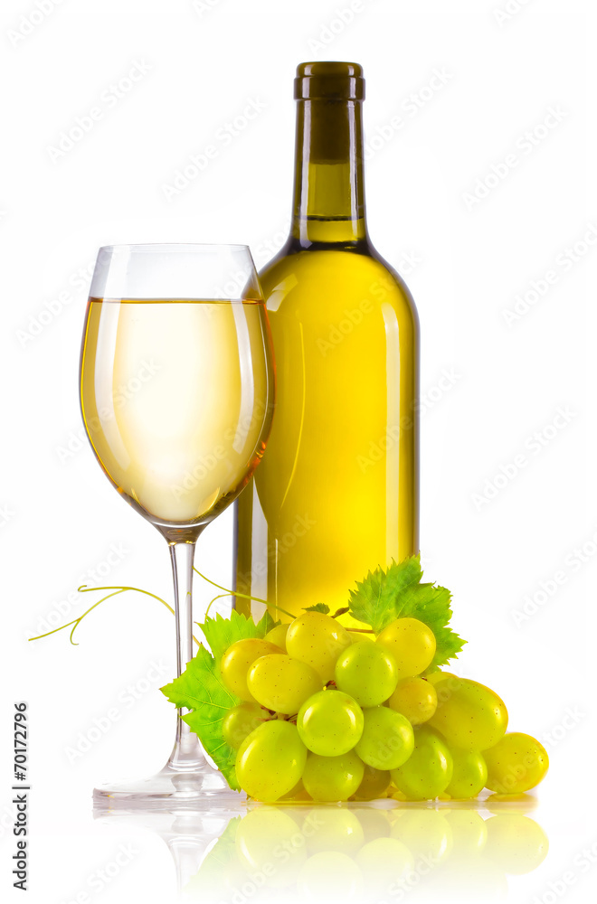 Glass of white wine with bottle and ripe grapes isolated