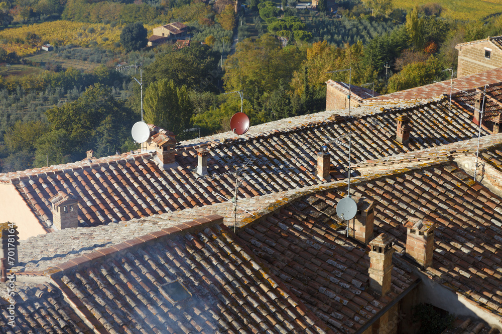 Close up of the traditional Italian red roof tiles in a small vi