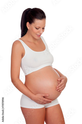 Pretty pregnant woman belly in underwear caressing her baby