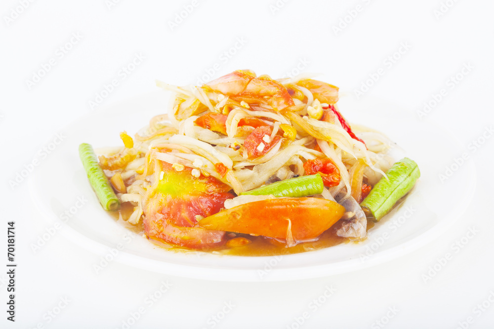 papaya salad on dish with white paper background papaya salad on dish with white paper background